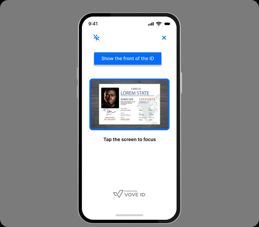 A smartphone screen showing an ID verification process with a sample driver’s license and a prompt to show the front of the ID.